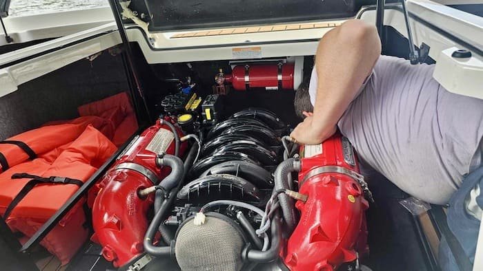 Christian from All-Sport Working on a boat engine