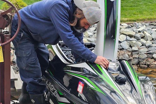 Logan from All-Sport working on a jet ski